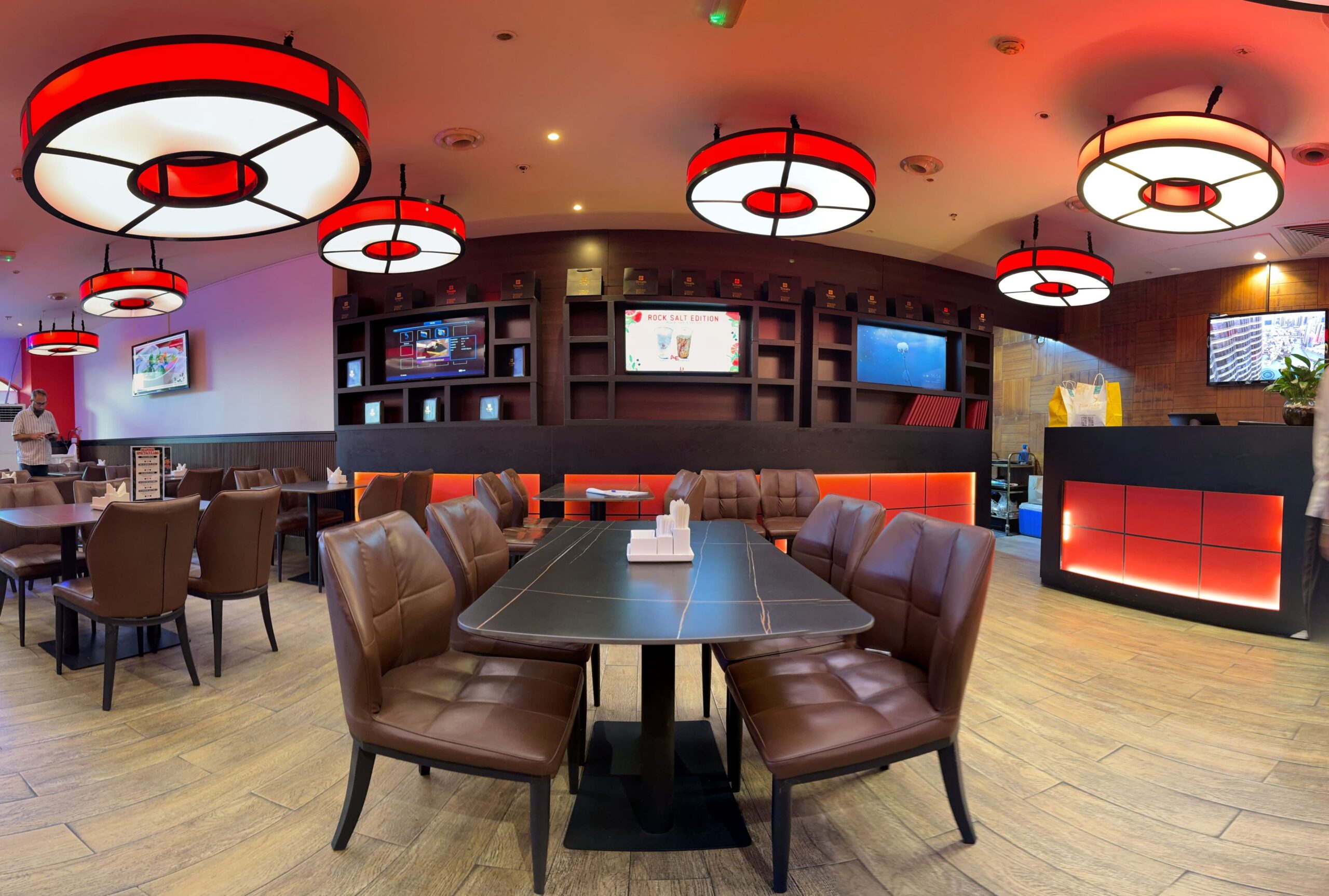 Hengchen Motor City dining room, with red pendant lighting and leather seating